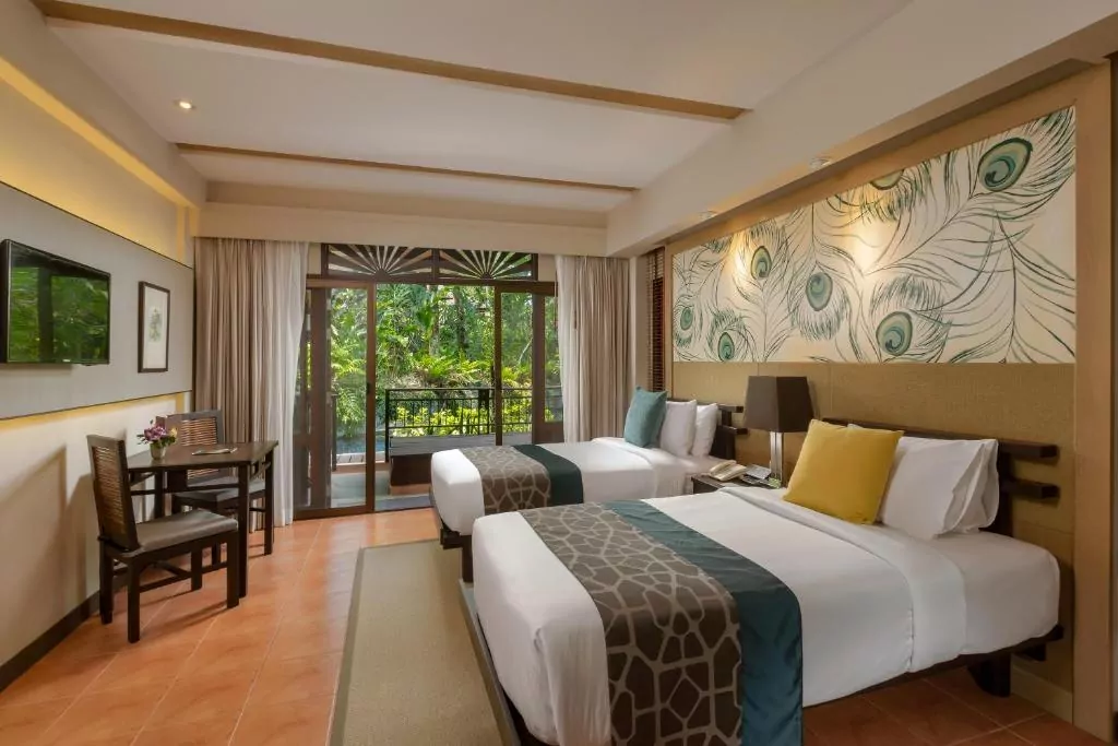 łóżka pościel lampki szafka krzesło telewizor okno